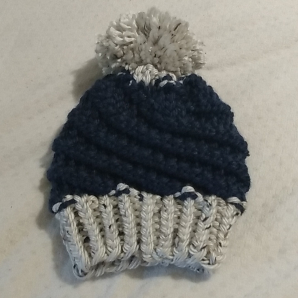 Hand-knit navy and cream spiral hat